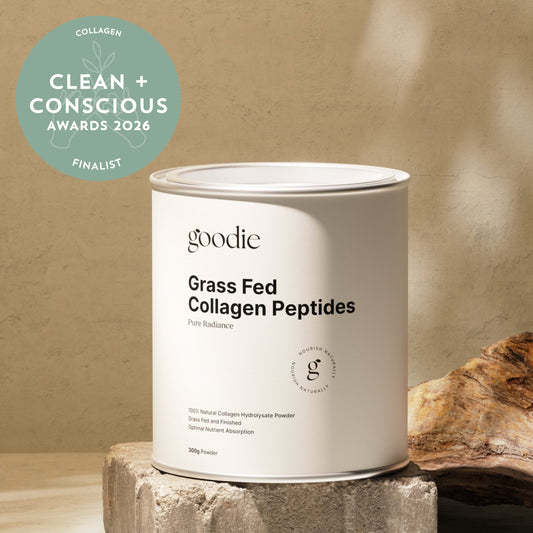 Container of goodie Grass Fed Collagen Peptides on a stone block with a beige background
